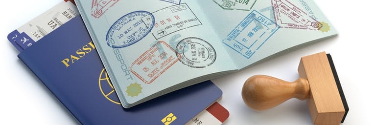 close up of someone holding a blue residency card in dubai