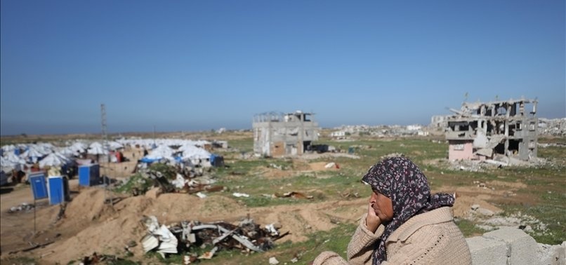 A man using a bicycle pump to help his mother breathe in Gaza
